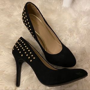 Black suede pump with gold stud heel